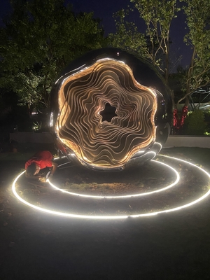 Outdoor garden at night large abstract sculpture LED lights with light wave changes welcome custom sculpture