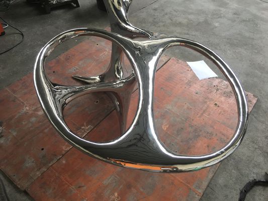 Stainless steel sculptural tables for abstract style interior decor